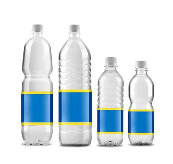 Four different sizes of bottled water isolated on white background, highlighting alternatives when questioning 'can you drink tap water in Bali?' for travelers' safety.