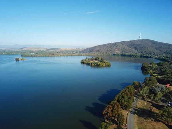 Panoramic view of Lake Burley Griffin in Canberra, reflecting a tranquil side of the city in the 'Adelaide and Canberra' exploration.