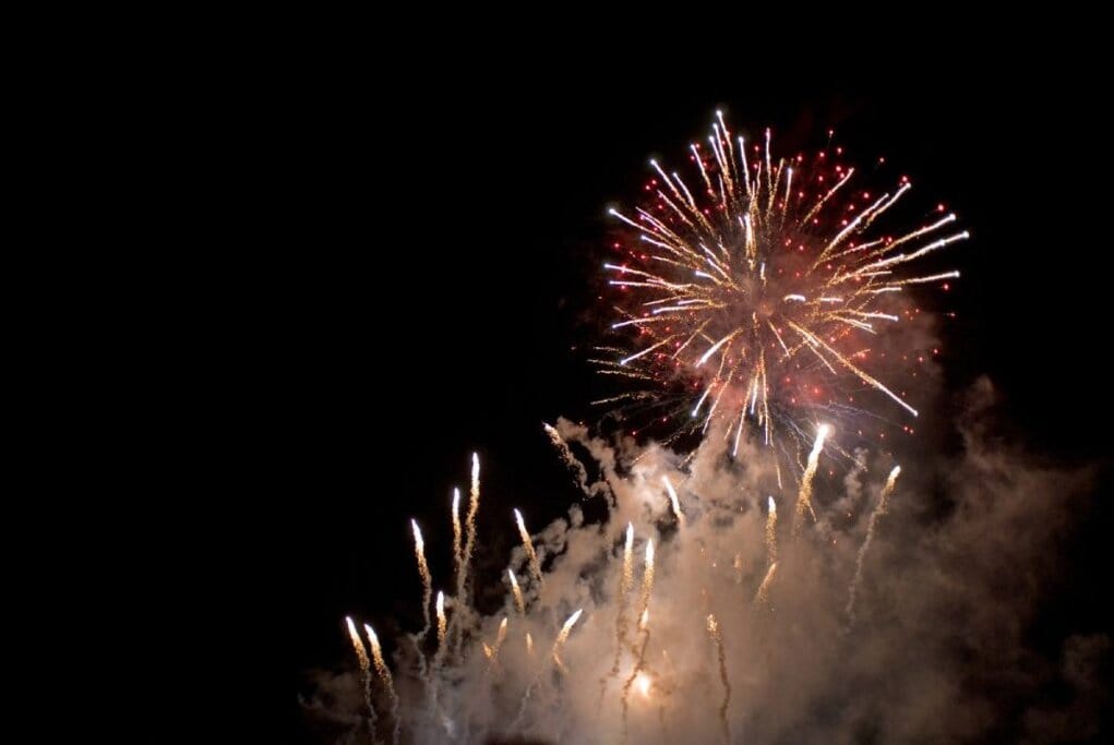 Fireworks lighting up the night sky, a vibrant display often seen during Australian celebrations like Australia Day. This ties into quirky Aussie traditions, where large public gatherings and fireworks are a part of the festive spirit.