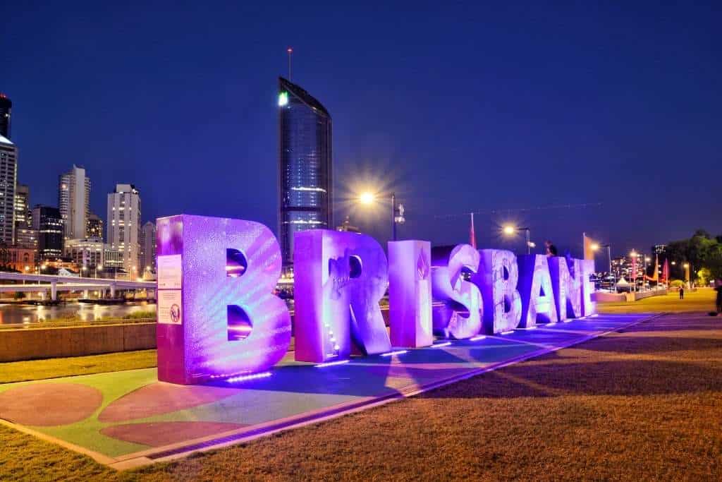 Large BRISBANE letters set against the backdrop of the city centre, highlighting Brisbane's charm in the Sydney or Brisbane comparison.