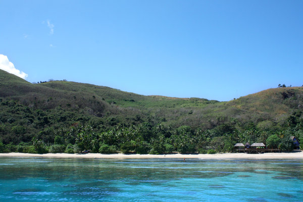 A beach in Fiji offering mountain and sea views
