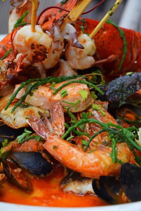 A grilled seafood platter featuring prawns, mussels, and lobster, highlighting fresh seafood options for Melbourne Christmas lunch dining experiences, where seafood is a popular choice for festive celebrations.