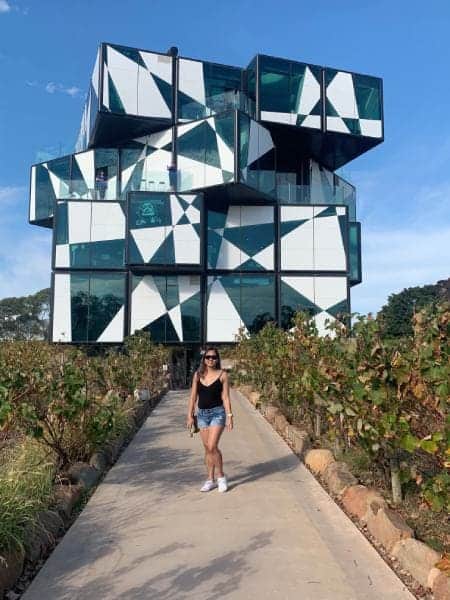 The author, Kate, in front of the d'Arenberg Cube, an iconic and avant-garde building nestled in the heart of McLaren Vale, a prime destination for celebrating Valentine's Day in Adelaide with wine tasting and vineyard tours.
