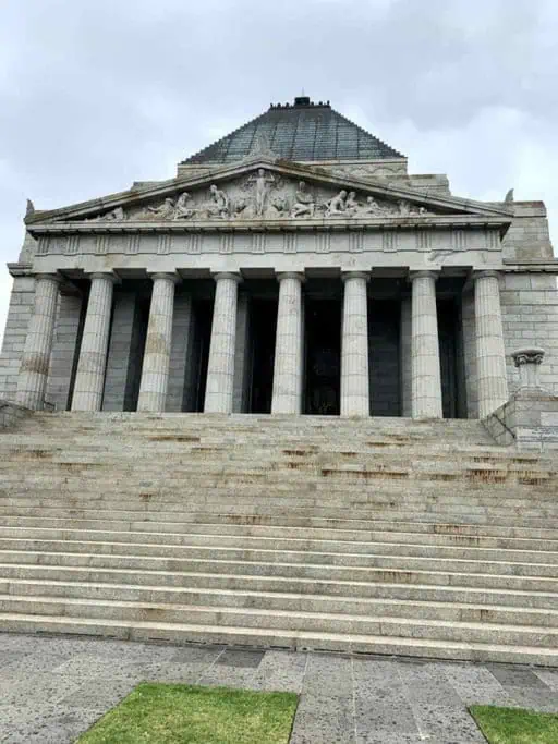 The Shrine of Remembrance in Melbourne, featuring its grand steps and classical architecture. This significant landmark is one of Melbourne's most Instagrammable places, offering a majestic and solemn backdrop perfect for capturing photos that highlight the city's history and architectural beauty.