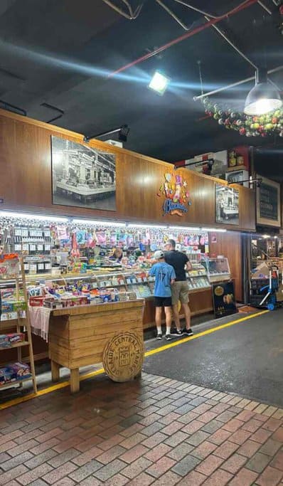 Customers exploring a vibrant candy store at the Adelaide Central Market, a popular indoor activity in Adelaide, especially during the winter season.