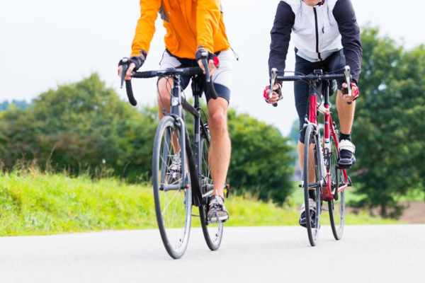 two cyclists on their bikes for a bike tour
